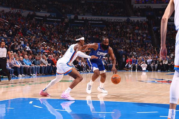 OKLAHOMA CITY, OK - DECEMBER 21: James Harden #1 of the LA Clippers handles the ball during the game on December 21, 2023 at Paycom Arena in Oklahoma City, Oklahoma. NOTE TO USER: User expressly acknowledges and agrees that, by downloading and or using this photograph, User is consenting to the terms and conditions of the Getty Images License Agreement. Mandatory Copyright Notice: Copyright 2023 NBAE (Photo by Zach Beeker/NBAE via Getty Images)