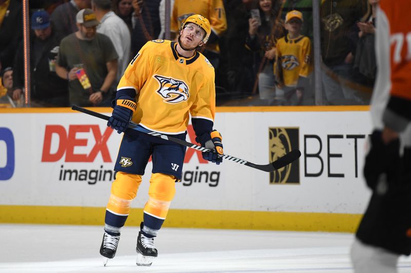 Dec 12, 2023; Nashville, Tennessee, USA; Nashville Predators center Gustav Nyquist (14) watches a replay of his goal during the first period against the Philadelphia Flyers at Bridgestone Arena. Mandatory Credit: Christopher Hanewinckel-USA TODAY Sports