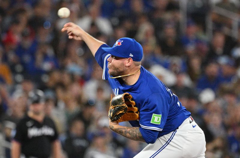 Sep 28, 2024; Toronto, Ontario, CAN;   Toronto Blue Jays starting pitcher Yariel Rodriguez (29) delivers a pitch against the Miami Marlins in the first inning at Rogers Centre. Mandatory Credit: Dan Hamilton-Imagn Images