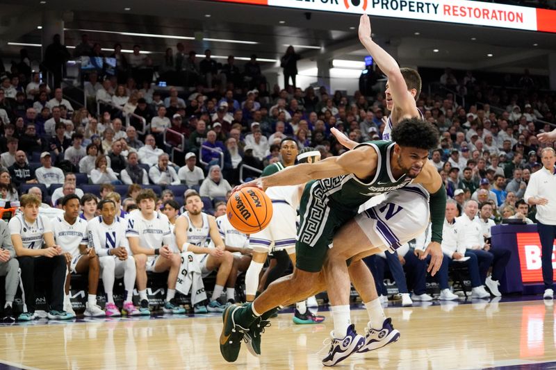 Jan 7, 2024; Evanston, Illinois, USA; Northwestern Wildcats guard Brooks Barnhizer (13) defends Michigan State Spartans forward Malik Hall (25) during the first half at Welsh-Ryan Arena. Mandatory Credit: David Banks-USA TODAY Sports