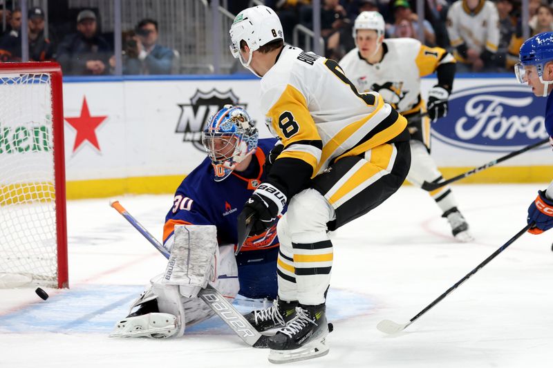 Nov 5, 2024; Elmont, New York, USA; Pittsburgh Penguins left wing Michael Bunting (8) scores a goal against New York Islanders goaltender Ilya Sorokin (30) during the third period at UBS Arena. Mandatory Credit: Brad Penner-Imagn Images