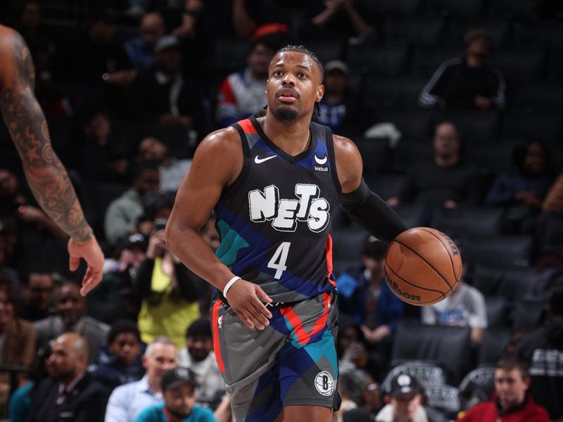 BROOKLYN, NY - JANUARY 29: Dennis Smith Jr. #4 of the Brooklyn Nets dribbles the ball during the game against the Utah Jazz on January 29, 2024 at Barclays Center in Brooklyn, New York. NOTE TO USER: User expressly acknowledges and agrees that, by downloading and or using this Photograph, user is consenting to the terms and conditions of the Getty Images License Agreement. Mandatory Copyright Notice: Copyright 2024 NBAE (Photo by Nathaniel S. Butler/NBAE via Getty Images)