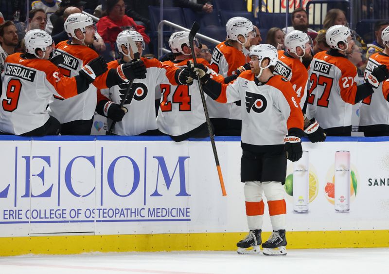 Dec 18, 2025; Buffalo, New York, USA;  Philadelphia Flyers defenseman Cam York (8) celebrates his goal with teammates during the second period against the Buffalo Sabres at KeyBank Center. Mandatory Credit: Timothy T. Ludwig-Imagn Images