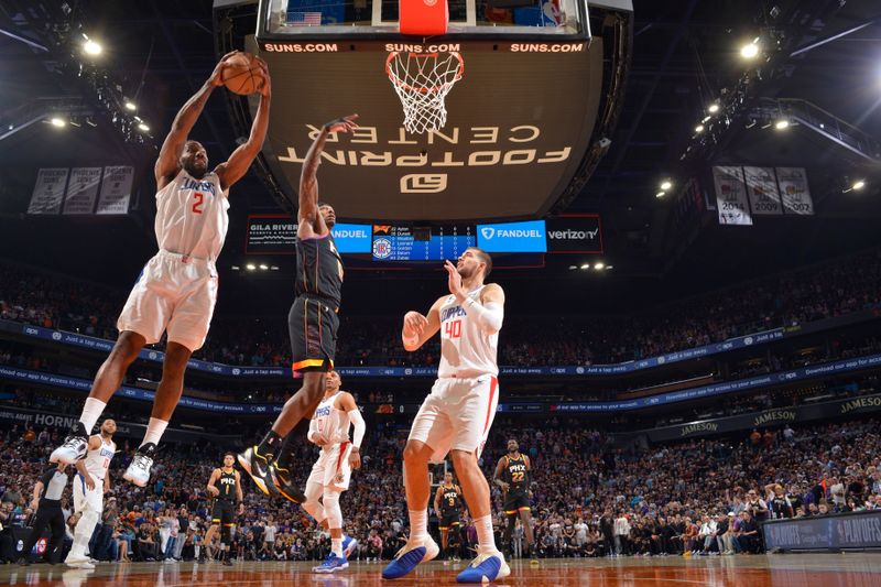 PHOENIX, AZ - APRIL 16:  Kawhi Leonard #2 of the LA Clippers grabs the rebound during the game During round one game one of the 2023 NBA Playoffs on April 16, 2023 at Footprint Center in Phoenix, Arizona. NOTE TO USER: User expressly acknowledges and agrees that, by downloading and or using this photograph, user is consenting to the terms and conditions of the Getty Images License Agreement. Mandatory Copyright Notice: Copyright 2023 NBAE (Photo by Barry Gossage/NBAE via Getty Images)