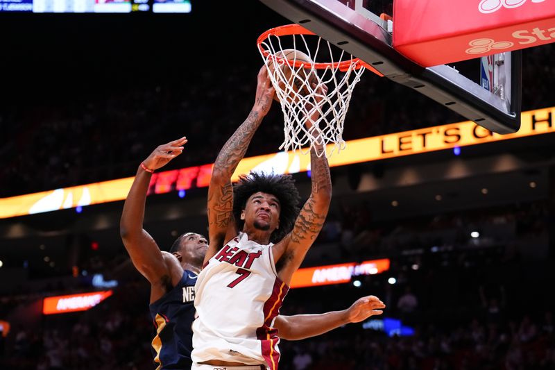 MIAMI, FLORIDA - OCTOBER 13: Kel'el Ware #7 of the Miami Heat collects a rebound against the New Orleans Pelicans during the fourth quarter of a preseason game at Kaseya Center on October 13, 2024 in Miami, Florida. NOTE TO USER: User expressly acknowledges and agrees that, by downloading and or using this photograph, User is consenting to the terms and conditions of the Getty Images License Agreement. (Photo by Rich Storry/Getty Images)