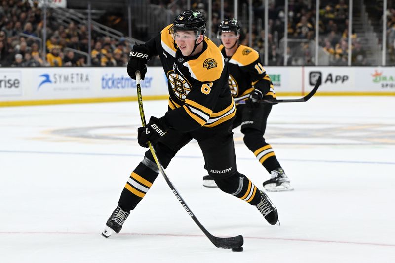 Oct 1, 2024; Boston, Massachusetts, USA; Boston Bruins defenseman Mason Lohrei (6) takes a shot against the Philadelphia Flyers during the first period at the TD Garden. Mandatory Credit: Brian Fluharty-Imagn Images