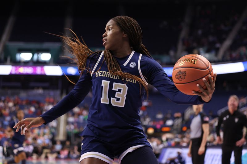 Mar 7, 2025; Greensboro, NC, USA;  Georgia Tech Yellow Jackets forward Kayla Blackshear (13) looks to pass during the second quarter against NC State Wolfpack at First Horizon Coliseum. Mandatory Credit: Cory Knowlton-Imagn Images