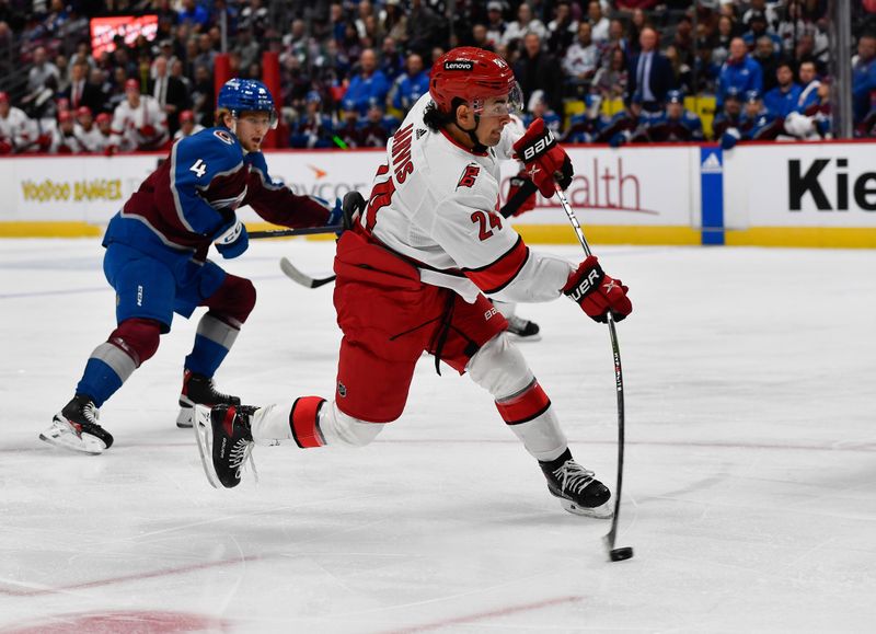 Oct 21, 2023; Denver, Colorado, USA; Carolina Hurricanes center Seth Jarvis (24) takes a shot on goal in the first period against the Colorado Avalanche at Ball Arena. Mandatory Credit: John Leyba-USA TODAY Sports