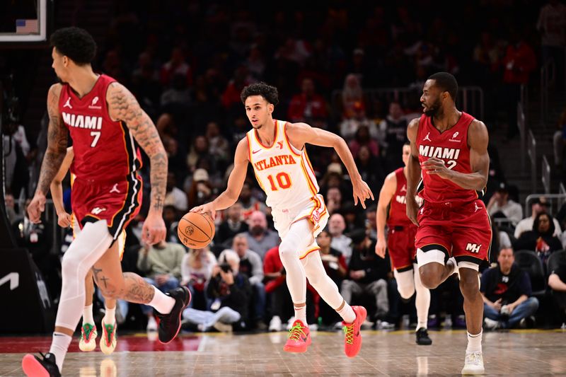 ATLANTA, GA - FEBRUARY 24: Zaccharie Risacher #10 of the Atlanta Hawks dribbles the ball during the game against the Miami Heat  on February 24, 2025 at State Farm Arena in Atlanta, Georgia.  NOTE TO USER: User expressly acknowledges and agrees that, by downloading and/or using this Photograph, user is consenting to the terms and conditions of the Getty Images License Agreement. Mandatory Copyright Notice: Copyright 2025 NBAE (Photo by Adam Hagy/NBAE via Getty Images)