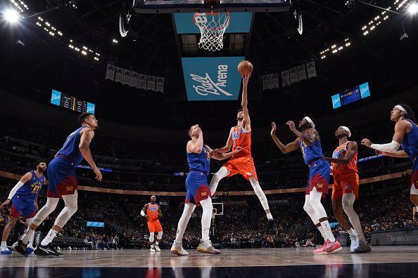 DENVER, CO - DECEMBER 16: Chet Holmgren #7 of the Oklahoma City Thunder drives to the basket during the game against the Denver Nuggets on December 16, 2023 at the Ball Arena in Denver, Colorado. NOTE TO USER: User expressly acknowledges and agrees that, by downloading and/or using this Photograph, user is consenting to the terms and conditions of the Getty Images License Agreement. Mandatory Copyright Notice: Copyright 2023 NBAE (Photo by Garrett Ellwood/NBAE via Getty Images)