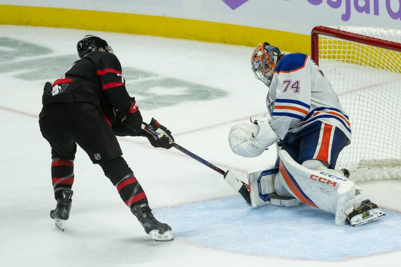 Nov 19, 2024; Ottawa, Ontario, CAN; Edmonton Oilers goalie Stuart Skinner (74) makes a save on a shot from  Ottawa Senators left wing Brady Tkachuk (7) in the third period at the Canadian Tire Centre. Mandatory Credit: Marc DesRosiers-Imagn Images