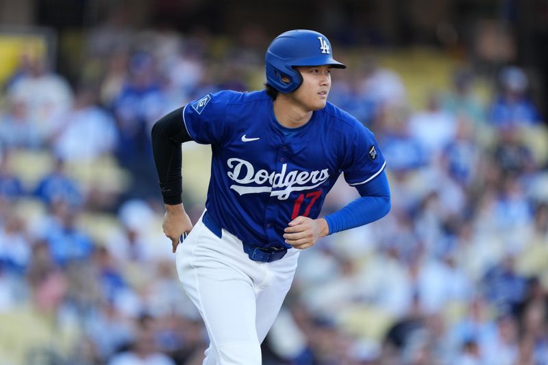 Mar 23, 2025; Los Angeles, California, USA; Los Angeles Dodgers two-way player Shohei Ohtani (17) runs the bases in the first inning against the Los Angeles Angels at Dodger Stadium. Mandatory Credit: Kirby Lee-Imagn Images