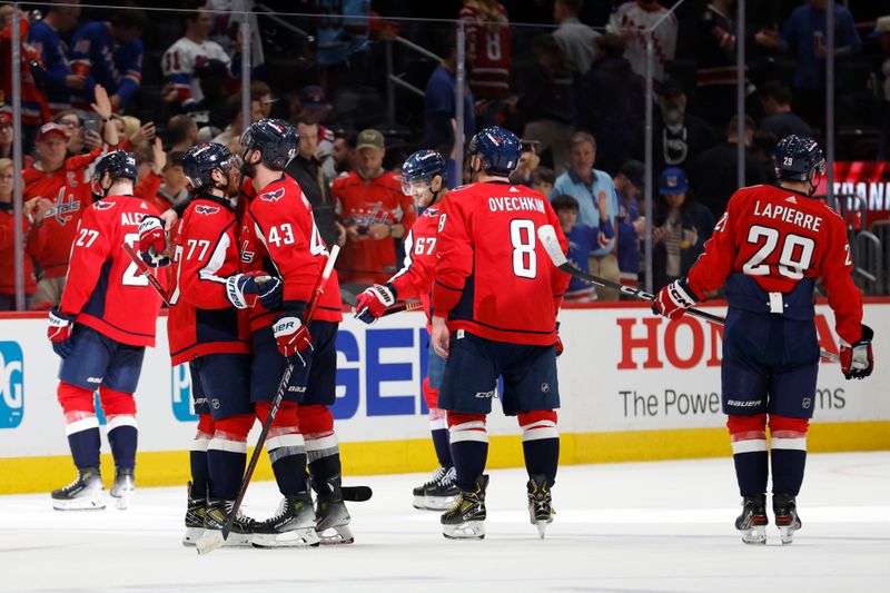 Apr 28, 2024; Washington, District of Columbia, USA; Washington Capitals right wing T.J. Oshie (77) hugs Capitals right wing Tom Wilson (43) before leaving the ice after their game against the New York Rangers in game four of the first round of the 2024 Stanley Cup Playoffs at Capital One Arena. Mandatory Credit: Geoff Burke-USA TODAY Sports