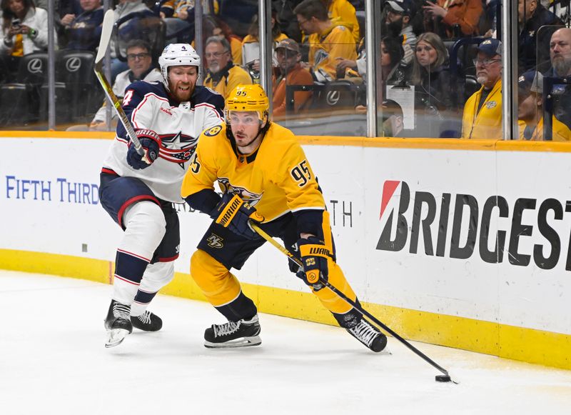 Jan 17, 2023; Nashville, Tennessee, USA;  Columbus Blue Jackets defenseman Vladislav Gavrikov (4) takes his stick against Nashville Predators center Matt Duchene (95) during the third period at Bridgestone Arena. Mandatory Credit: Steve Roberts-USA TODAY Sports