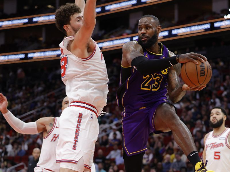 HOUSTON, TEXAS - NOVEMBER 08: LeBron James #23 of the Los Angeles Lakers dishes a pass around Alperen Sengun #28 of the Houston Rockets during the first half at Toyota Center on November 08, 2023 in Houston, Texas. NOTE TO USER: User expressly acknowledges and agrees that, by downloading and or using this photograph, User is consenting to the terms and conditions of the Getty Images License Agreement.? (Photo by Carmen Mandato/Getty Images)