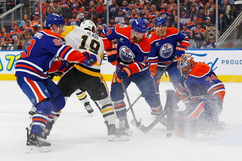 Oct 25, 2024; Edmonton, Alberta, CAN; Pittsburgh Penguins forward Cody Glass (19) looks for a loose puck in front of Edmonton Oilers goaltender Stuart Skinner (74) during the second period at Rogers Place. Mandatory Credit: Perry Nelson-Imagn Images