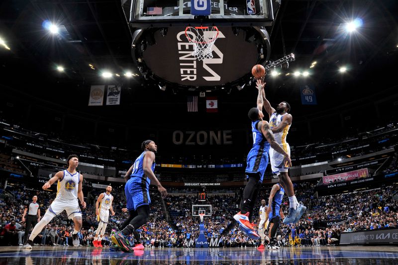 ORLANDO, FL - MARCH 27: Andrew Wiggins #22 of the Golden State Warriors drives to the basket during the game against the Orlando Magic on March 27, 2024 at Amway Center in Orlando, Florida. NOTE TO USER: User expressly acknowledges and agrees that, by downloading and or using this photograph, User is consenting to the terms and conditions of the Getty Images License Agreement. Mandatory Copyright Notice: Copyright 2024 NBAE (Photo by Fernando Medina/NBAE via Getty Images)