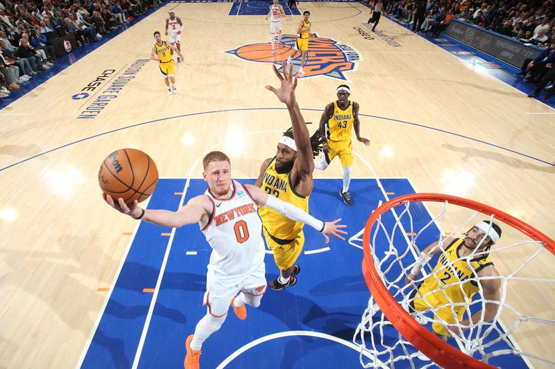 NEW YORK, NY - MAY 19: Donte Divincenzo #0 of the New York Knicks drives to the basket during the game  against the Indiana Pacers during Round 2 Game 7 of the 2024 NBA Playoffs on May 19, 2024 at Madison Square Garden in New York City, New York.  NOTE TO USER: User expressly acknowledges and agrees that, by downloading and or using this photograph, User is consenting to the terms and conditions of the Getty Images License Agreement. Mandatory Copyright Notice: Copyright 2024 NBAE  (Photo by Nathaniel S. Butler/NBAE via Getty Images)