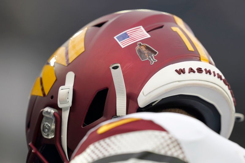 Washington Commanders wide receiver Terry McLaurin wears a Walter Payton NFL Man of the Year Award logo on the back of his helmet before an NFL football game against the Los Angeles Rams Sunday, Dec. 17, 2023, in Los Angeles. (AP Photo/Ryan Sun)