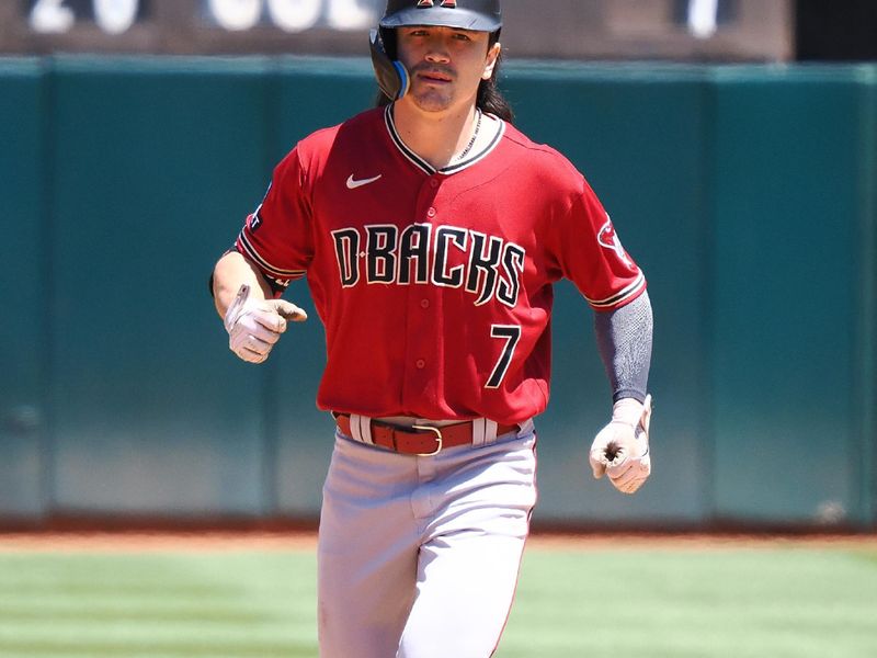 May 17, 2023; Oakland, California, USA; Arizona Diamondbacks right fielder Corbin Carroll (7) rounds the bases after hitting a two-run home run against the Oakland Athletics during the sixth inning at Oakland-Alameda County Coliseum. Mandatory Credit: Kelley L Cox-USA TODAY Sports