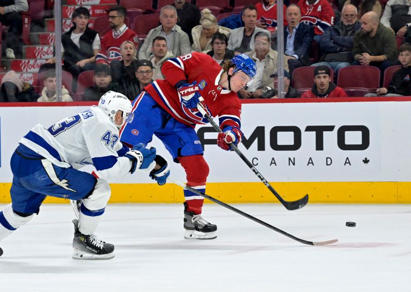 Nov 7, 2023; Montreal, Quebec, CAN; Montreal Canadiens forward Christian Dvorak (28) scores a goal against the Tampa Bay Lightning during the third period at the Bell Centre. Mandatory Credit: Eric Bolte-USA TODAY Sports