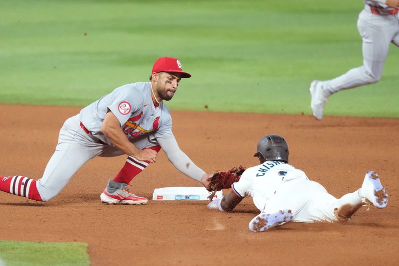 Jun 17, 2024; Miami, Florida, USA;  St. Louis Cardinals second baseman José Fermín (15) tags out Miami Marlins centerfielder Jazz Chisholm Jr. (2) trying to steal second base in the fourth inning at loanDepot Park. Mandatory Credit: Jim Rassol-USA TODAY Sports