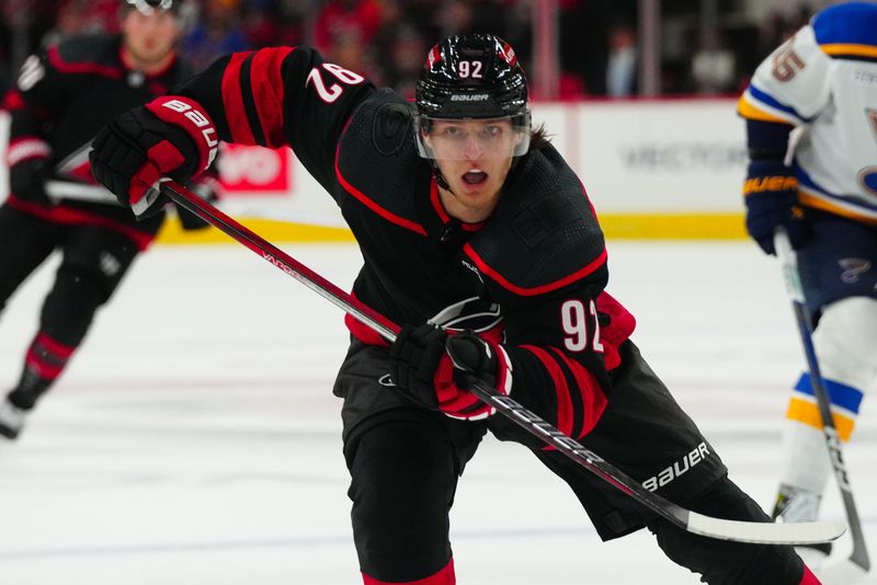 Jan 6, 2024; Raleigh, North Carolina, USA; Carolina Hurricanes center Vasiliy Ponomarev (92) skates against the St. Louis Blues during the first period at PNC Arena. Mandatory Credit: James Guillory-USA TODAY Sports