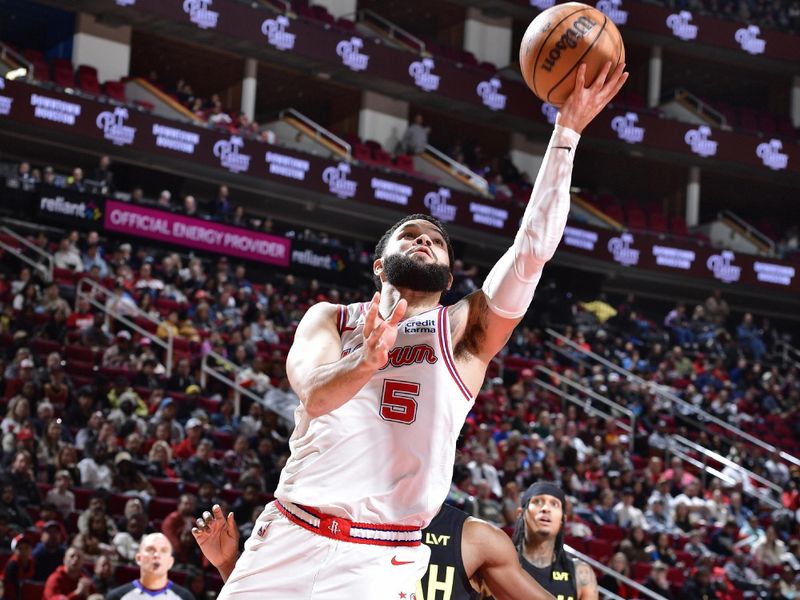 HOUSTON, TX - JANUARY 20: Fred VanVleet #5 of the Houston Rockets drives to the basket during the game against the Utah Jazz on January 20, 2024 at the Toyota Center in Houston, Texas. NOTE TO USER: User expressly acknowledges and agrees that, by downloading and or using this photograph, User is consenting to the terms and conditions of the Getty Images License Agreement. Mandatory Copyright Notice: Copyright 2024 NBAE (Photo by Logan Riely/NBAE via Getty Images)