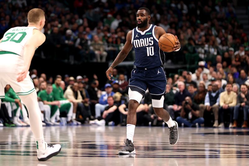 DALLAS, TEXAS - JANUARY 22: Tim Hardaway Jr. #10 of the Dallas Mavericks dribbles the ball up court against the Boston Celtics in the first half at American Airlines Center on January 22, 2024 in Dallas, Texas. NOTE TO USER: User expressly acknowledges and agrees that, by downloading and or using this photograph, User is consenting to the terms and conditions of the Getty Images License Agreement. (Photo by Tim Heitman/Getty Images)