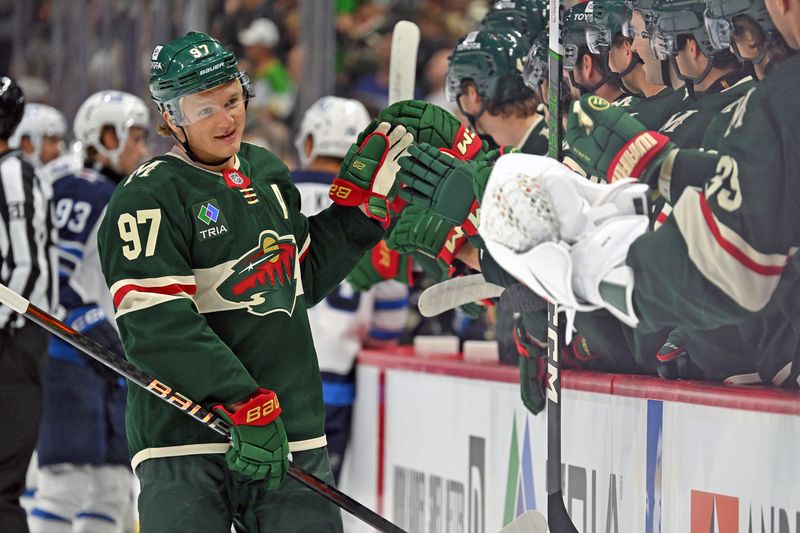 Sep 27, 2024; Saint Paul, Minnesota, USA;  Minnesota Wild forward Kirill Kaprizov (97) celebrates his power play goal against the Winnipeg Jets during the first period at Xcel Energy Center. Mandatory Credit: Nick Wosika-Imagn Images

