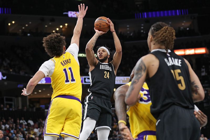 MEMPHIS, TENNESSEE - MARCH 27: Lamar Stevens #24 of the Memphis Grizzlies takes a shot against Jaxson Hayes #11 of the Los Angeles Lakers during the second half at FedExForum on March 27, 2024 in Memphis, Tennessee. NOTE TO USER: User expressly acknowledges and agrees that, by downloading and or using this photograph, User is consenting to the terms and conditions of the Getty Images License Agreement. (Photo by Justin Ford/Getty Images)