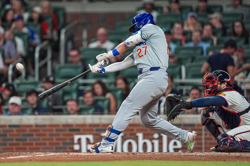 May 15, 2024; Cumberland, Georgia, USA; Chicago Cubs right fielder Seiya Suzuki (27)  hits a home run against the Atlanta Braves during the eighth inning at Truist Park. Mandatory Credit: Dale Zanine-USA TODAY Sports