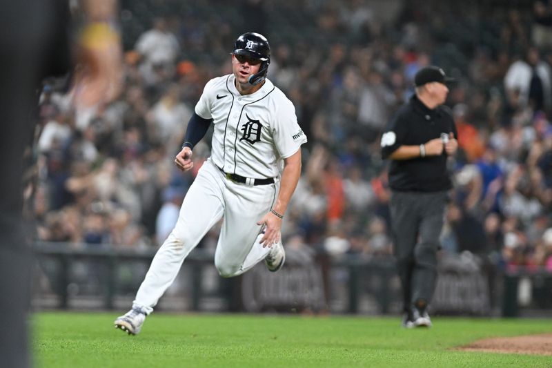 Aug 21, 2023; Detroit, Michigan, USA; Detroit Tigers first baseman Spencer Torkelson (20) scores a run against the Chicago Cubs in the ninth inning at Comerica Park. Mandatory Credit: Lon Horwedel-USA TODAY Sports