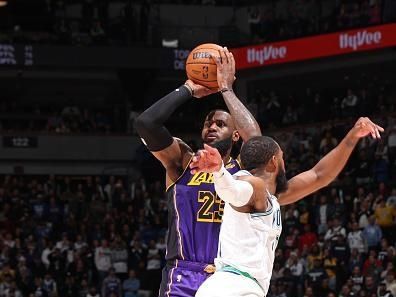MINNEAPOLIS, MN -  DECEMBER 30: LeBron James #23 of the Los Angeles Lakers three point basket during the game against the Minnesota Timberwolves on December 30, 2023 at Target Center in Minneapolis, Minnesota. NOTE TO USER: User expressly acknowledges and agrees that, by downloading and or using this Photograph, user is consenting to the terms and conditions of the Getty Images License Agreement. Mandatory Copyright Notice: Copyright 2023 NBAE (Photo by David Sherman/NBAE via Getty Images)