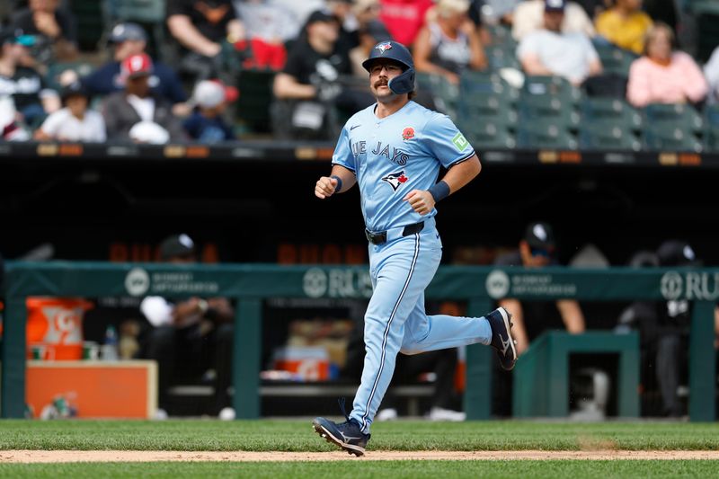 May 27, 2024; Chicago, Illinois, USA; Toronto Blue Jays outfielder Davis Schneider (36) rounds the bases after hitting a two-run home run against the Chicago White Sox during the ninth inning at Guaranteed Rate Field. Mandatory Credit: Kamil Krzaczynski-USA TODAY Sports