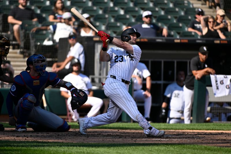 Aug 29, 2024; Chicago, Illinois, USA;  Chicago White Sox outfielder Andrew Benintendi (23) hits a home run against the Texas Rangers during the ninth inning at Guaranteed Rate Field. Mandatory Credit: Matt Marton-USA TODAY Sports