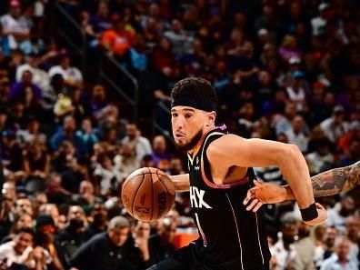 PHOENIX, AZ - NOVEMBER 15: Devin Booker #1 of the Phoenix Suns dribbles the ball during the game against the Minnesota Timberwolves on November 15, 2023 at Footprint Center in Phoenix, Arizona. NOTE TO USER: User expressly acknowledges and agrees that, by downloading and or using this photograph, user is consenting to the terms and conditions of the Getty Images License Agreement. Mandatory Copyright Notice: Copyright 2023 NBAE (Photo by Barry Gossage/NBAE via Getty Images)