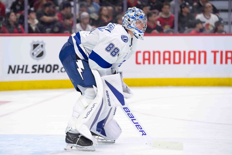 Oct 19, 2024; Ottawa, Ontario, CAN; Tampa Bay Lightning goalie Andrei Vasilevskiy (88) looks up the ice in the first period of game against the Ottawa Senators at the Canadian Tire Centre. Mandatory Credit: Marc DesRosiers-Imagn Images