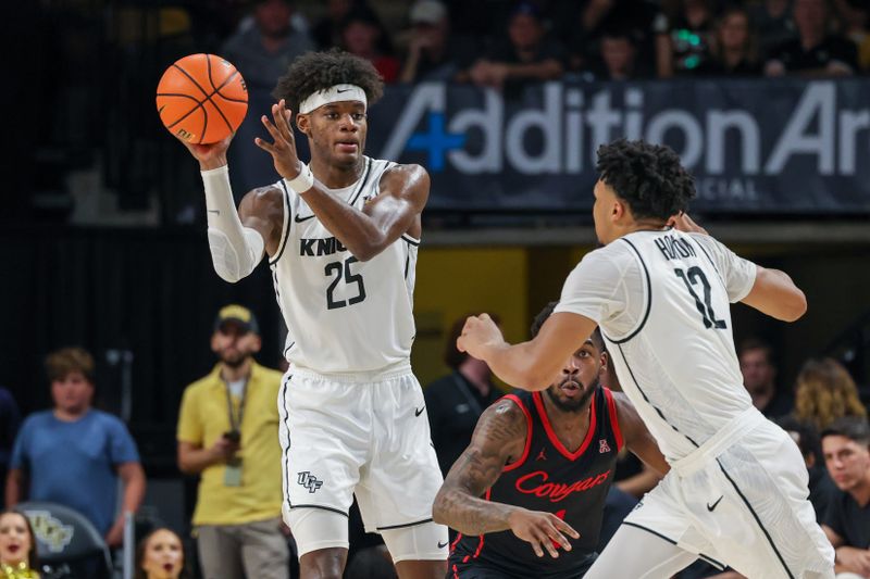 Jan 25, 2023; Orlando, Florida, USA; UCF Knights forward Taylor Hendricks (25) looks to pass during the second half against the Houston Cougars at Addition Financial Arena. Mandatory Credit: Mike Watters-USA TODAY Sports