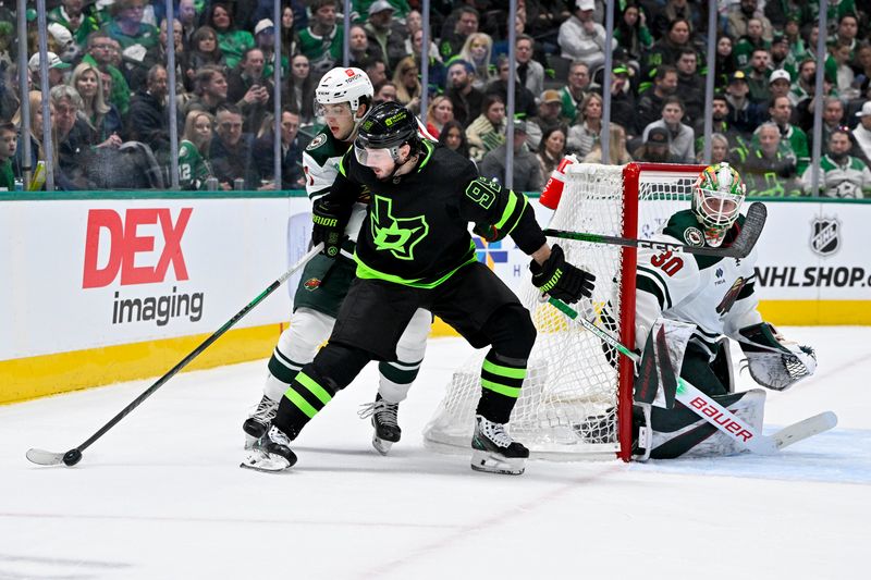 Jan 10, 2024; Dallas, Texas, USA; Dallas Stars center Matt Duchene (95) controls the puck in front Minnesota Wild defenseman Brock Faber (7) and goaltender Jesper Wallstedt (30) during the second period at the American Airlines Center. Mandatory Credit: Jerome Miron-USA TODAY Sports