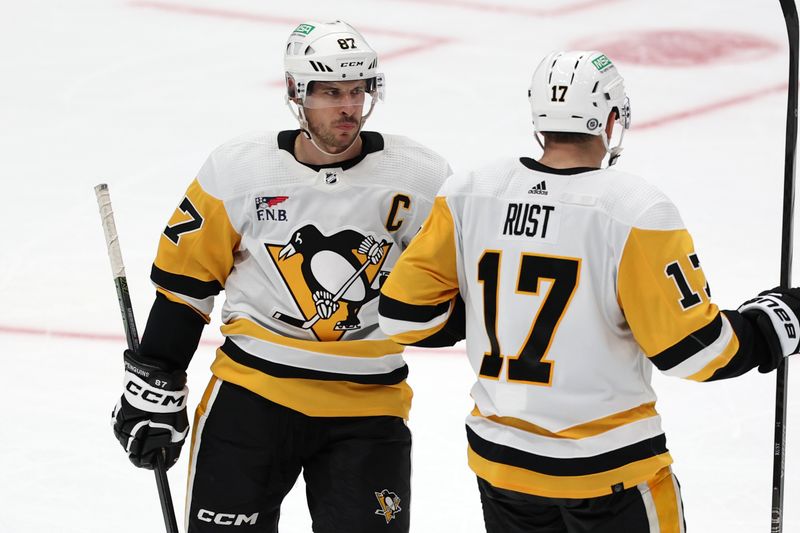 Nov 7, 2023; Anaheim, California, USA; Pittsburgh Penguins center Sidney Crosby (87) is greeted by right wing Bryan Rust (17) after scoring an empty net goal in the third period against the Anaheim Ducks at Honda Center. Mandatory Credit: Kiyoshi Mio-USA TODAY Sports