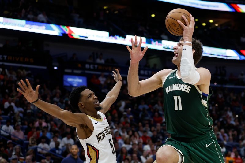 NEW ORLEANS, LOUISIANA - MARCH 28: Brook Lopez #11 of the Milwaukee Bucks shoots the ball over Herbert Jones #5 of the New Orleans Pelicans at Smoothie King Center on March 28, 2024 in New Orleans, Louisiana. (Photo by Chris Graythen/Getty Images)