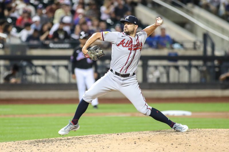 Aug 11, 2023; New York City, New York, USA; Atlanta Braves relief pitcher Brad Hand (45) pitches in the seventh inning against the New York Mets at Citi Field. Mandatory Credit: Wendell Cruz-USA TODAY Sports