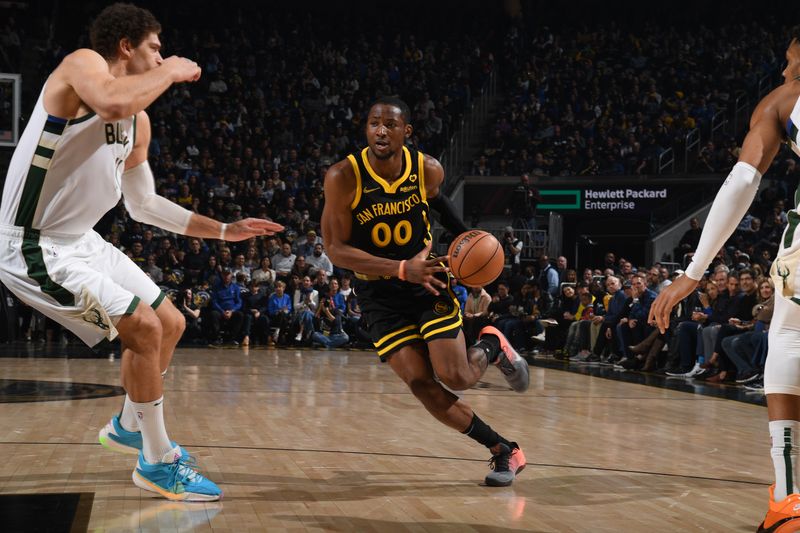 SAN FRANCISCO, CA - MARCH 6:  Jonathan Kuminga #00 of the Golden State Warriors drives to the basket during the game against the Milwaukee Bucks on MARCH 6, 2024 at Chase Center in San Francisco, California. NOTE TO USER: User expressly acknowledges and agrees that, by downloading and or using this photograph, user is consenting to the terms and conditions of Getty Images License Agreement. Mandatory Copyright Notice: Copyright 2024 NBAE (Photo by Noah Graham/NBAE via Getty Images)