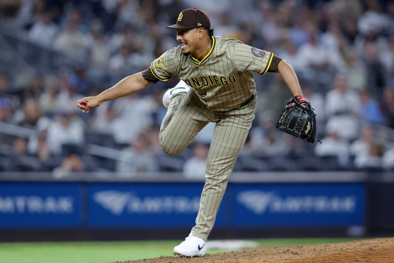 May 7, 2025; Bronx, New York, USA; San Diego Padres relief pitcher Jeremiah Estrada (56) follows through on a pitch against the New York Yankees during the tenth inning at Yankee Stadium. Mandatory Credit: Brad Penner-Imagn Images