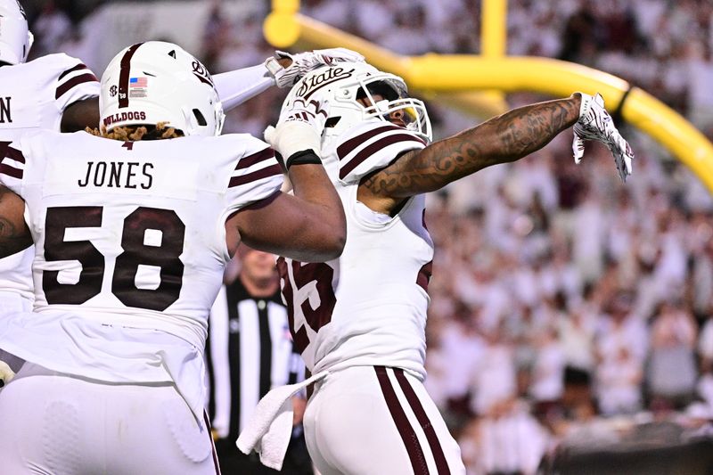 Sep 9, 2023; Starkville, Mississippi, USA; Mississippi State Bulldogs running back Jeffery Pittman (25) reacts teammates after a touchdown against the Arizona Wildcats during overtime at Davis Wade Stadium at Scott Field. Mandatory Credit: Matt Bush-USA TODAY Sports