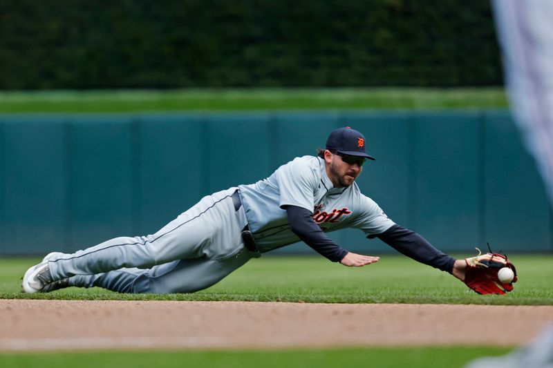 Apr 20, 2024; Minneapolis, Minnesota, USA; Detroit Tigers second baseman Buddy Kennedy (40) falls short of fielding a single by Minnesota Twins second baseman Edouard Julien (not pictured) in the seventh inning at Target Field. Mandatory Credit: Bruce Kluckhohn-USA TODAY Sports