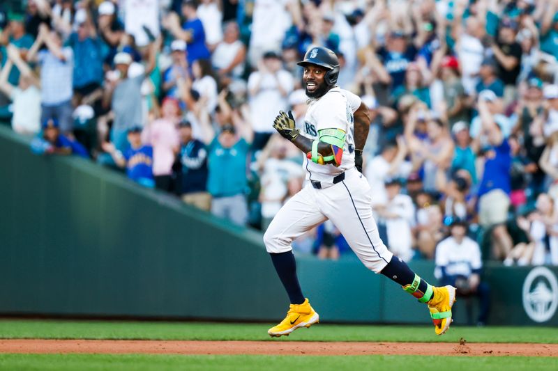 Jun 30, 2025; Seattle, Washington, USA; Seattle Mariners left fielder Randy Arozarena (56) celebrates while running the bases after hitting a three-run home run against the Kansas City Royals during the fifth inning at T-Mobile Park. Mandatory Credit: Joe Nicholson-Imagn Images