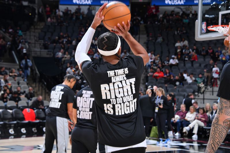 SAN ANTONIO, TX - JANUARY 13: Devonte Graham #4 of the San Antonio Spurs warms up in a shirt in honor of Martin Luther King Jr. before the game against the Chicago Bulls on January 13, 2024 at the Frost Bank Center in San Antonio, Texas. NOTE TO USER: User expressly acknowledges and agrees that, by downloading and or using this photograph, user is consenting to the terms and conditions of the Getty Images License Agreement. Mandatory Copyright Notice: Copyright 2024 NBAE (Photos by Michael Gonzales/NBAE via Getty Images)