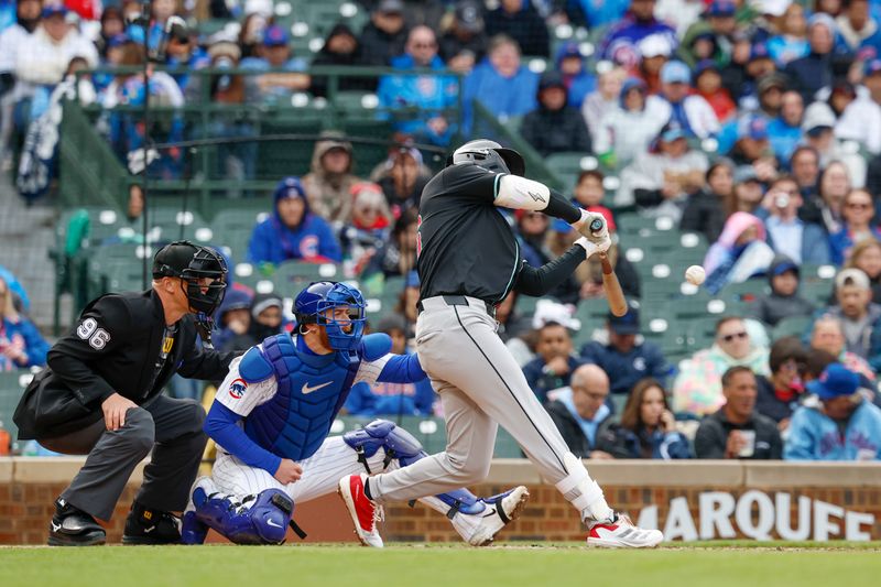 Apr 20, 2025; Chicago, Illinois, USA; Arizona Diamondbacks first baseman Pavin Smith (26) hits a ground-rule double against the Chicago Cubs during the fourth inning at Wrigley Field. Mandatory Credit: Kamil Krzaczynski-Imagn Images